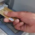 The behavior of being withdrawn by someone after the ATM has not taken the card